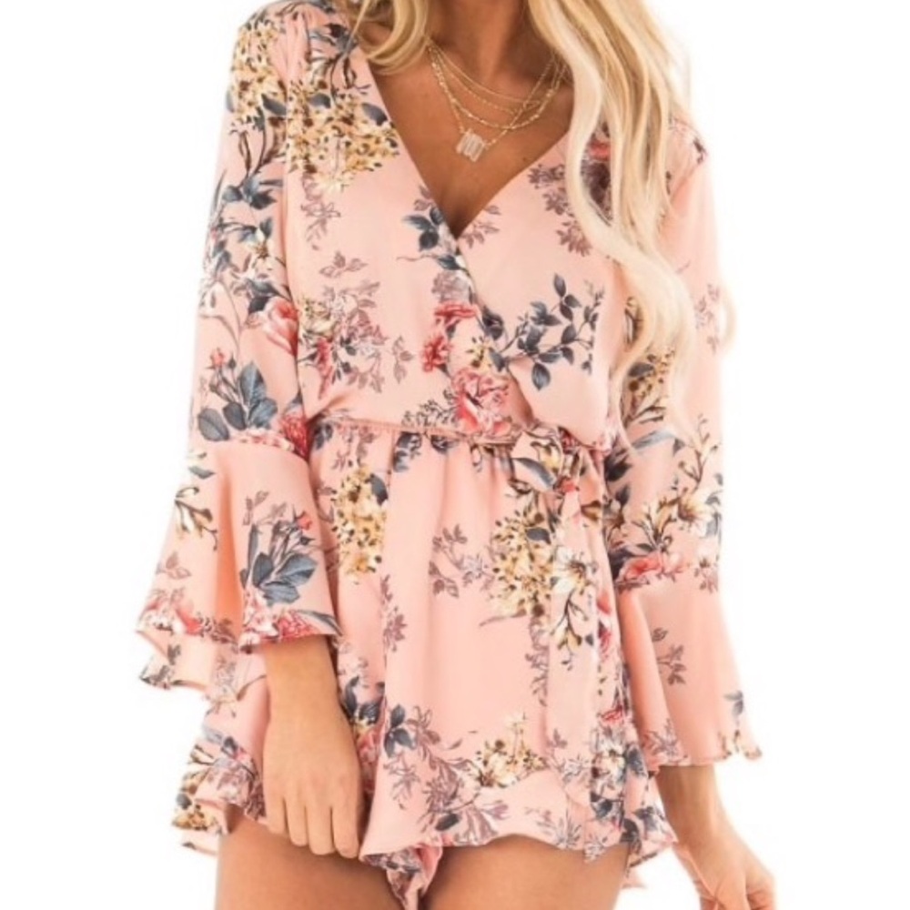 NWOT She + Sky Floral Wrap Style Romper lined, 3/4 sleeve. Size M